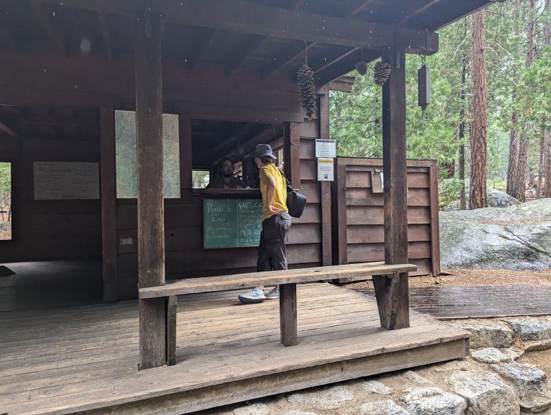 Road's End permit station, with a traveler talking to the ranger.